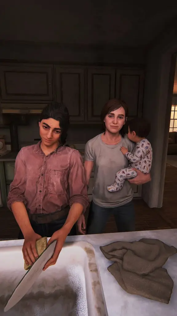 Dina washing dishes while Ellie holds a child in a domestic scene