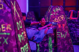 Laser game players using strategy and cover during an indoor match